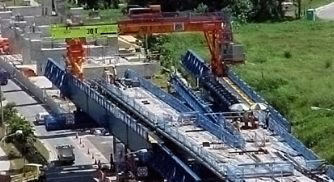 Underslung Self-Launching Gantries for Precast Segmental Bridges